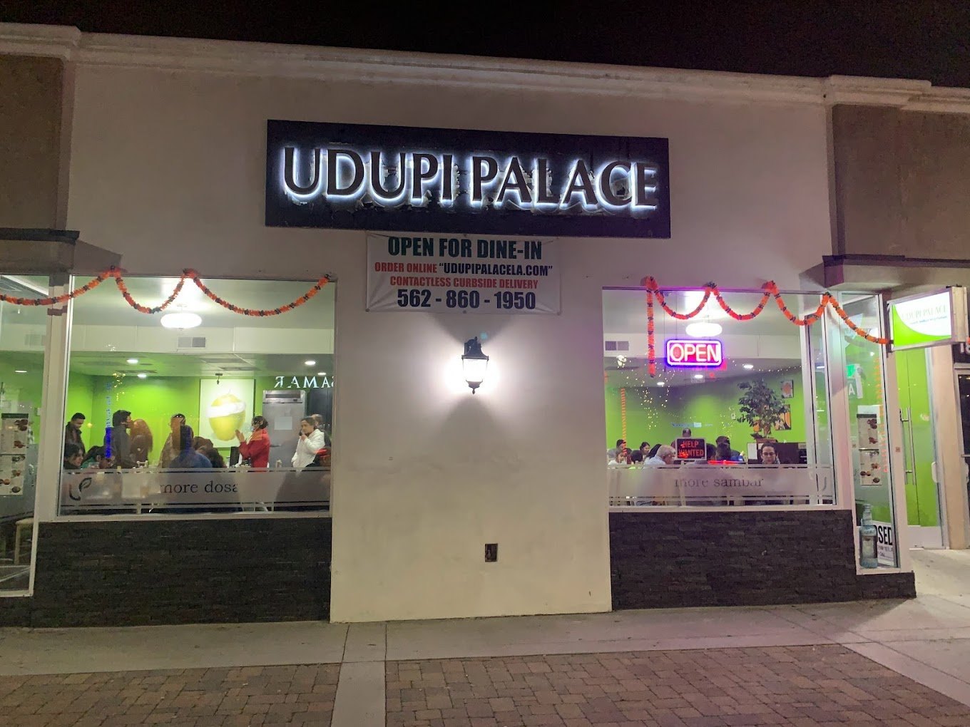 Udupi Palace exterior at night, Pioneer Boulevard